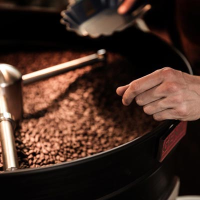 Coffee beans being roasted at At Origin Coffee, specialty coffee shop at 687 Mount Pleasant Road, Toronto
